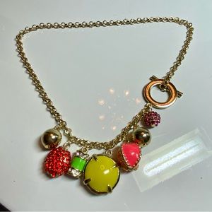 Gold tone rolo chair charm necklace.